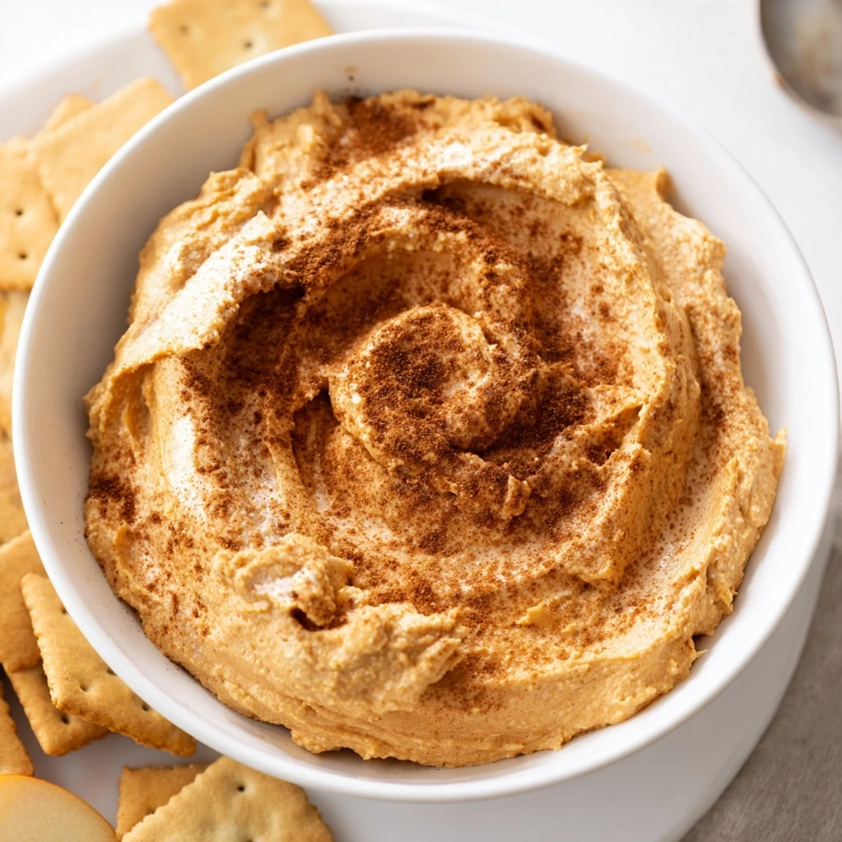 Creamy Thanksgiving Pumpkin Pie Dip served with sweet graham crackers for delightful snacking.  