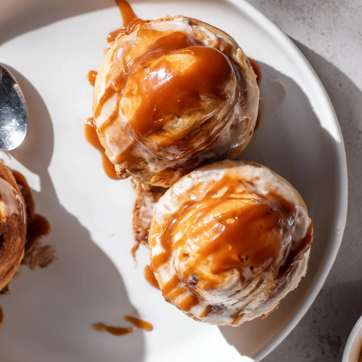 Fluffy chai caramel coffee pancake donuts drizzled with golden, rich caramel glaze.  