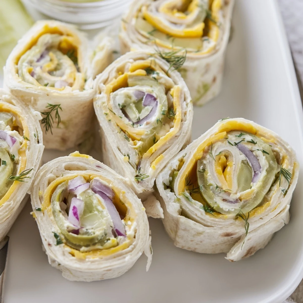 Easy-to-make Pickle-in-a-Blanket appetizers, drizzled with mustard for extra flavor.