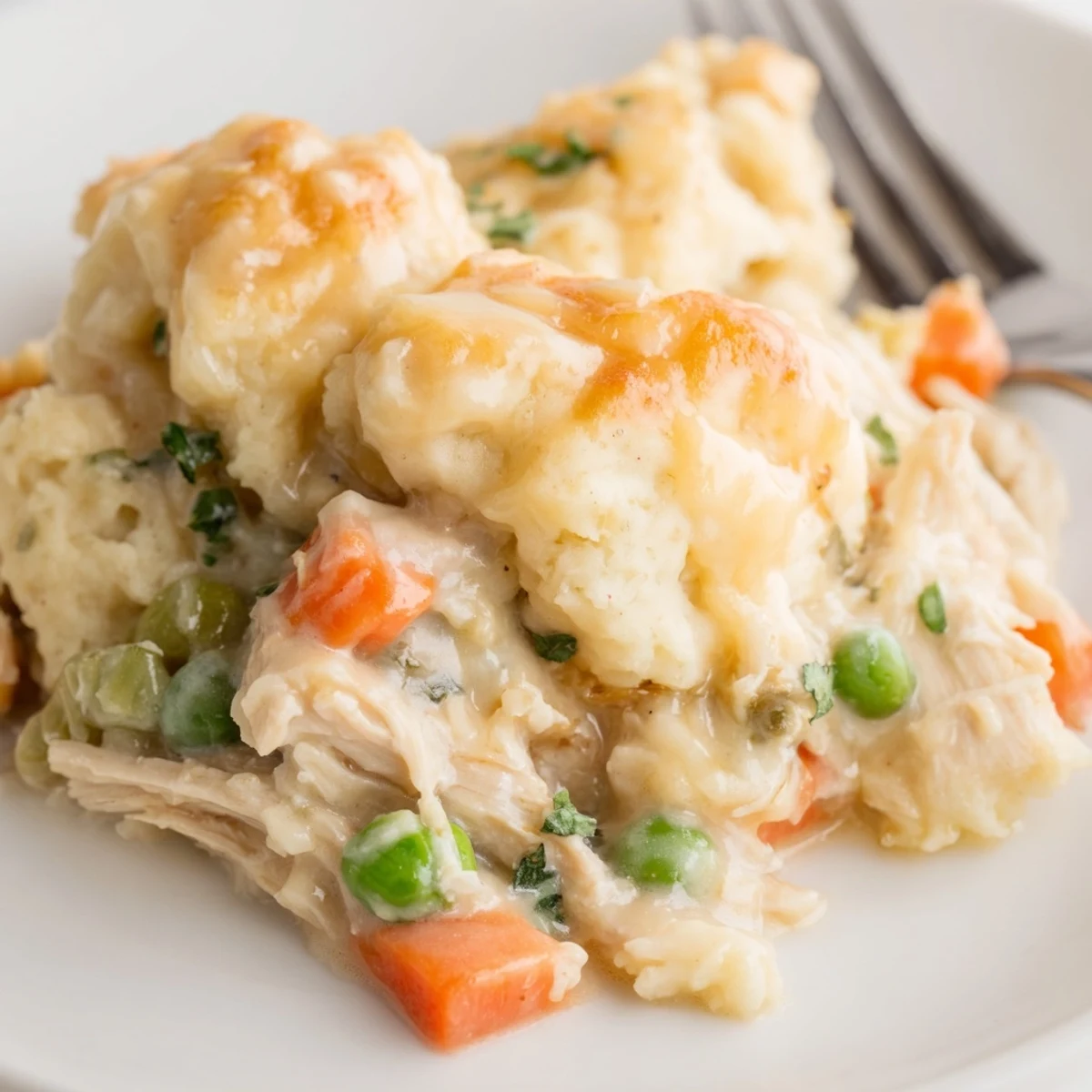 Comforting Chicken and Dumplings Casserole featuring tender chicken and vibrant vegetables.