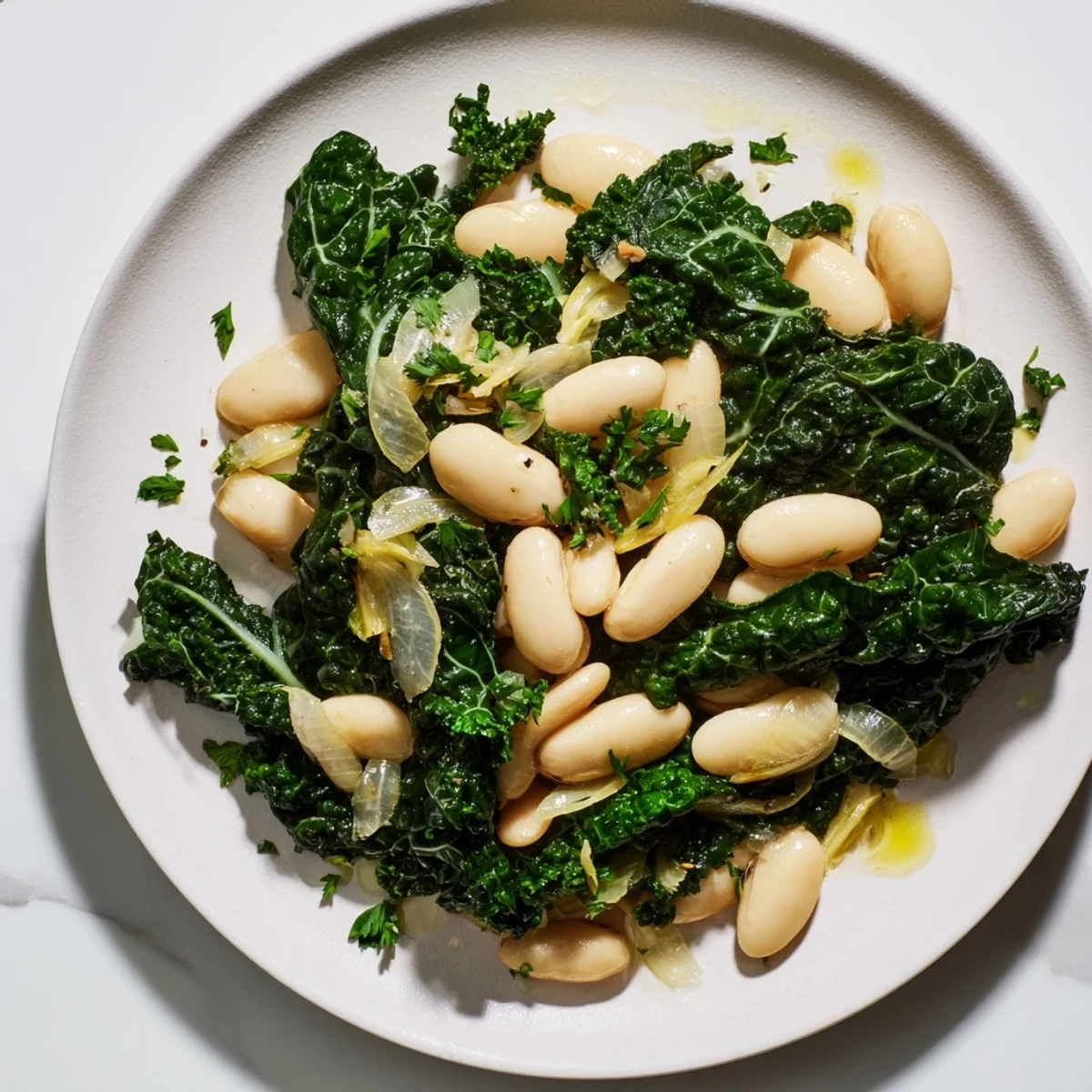 A close-up of the rustic Garlicky Beans with Winter Greens, showcasing tender greens and creamy beans.