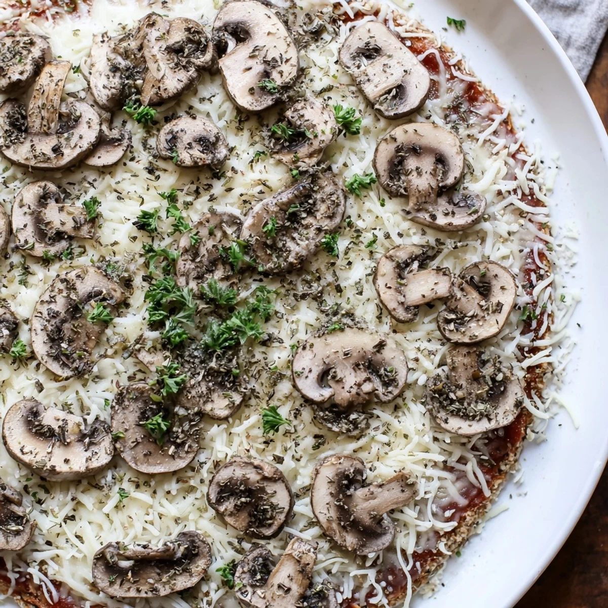 Close-up of a flavorful frozen pizza upgrade, showcasing the melted cheese and earthy mushrooms.