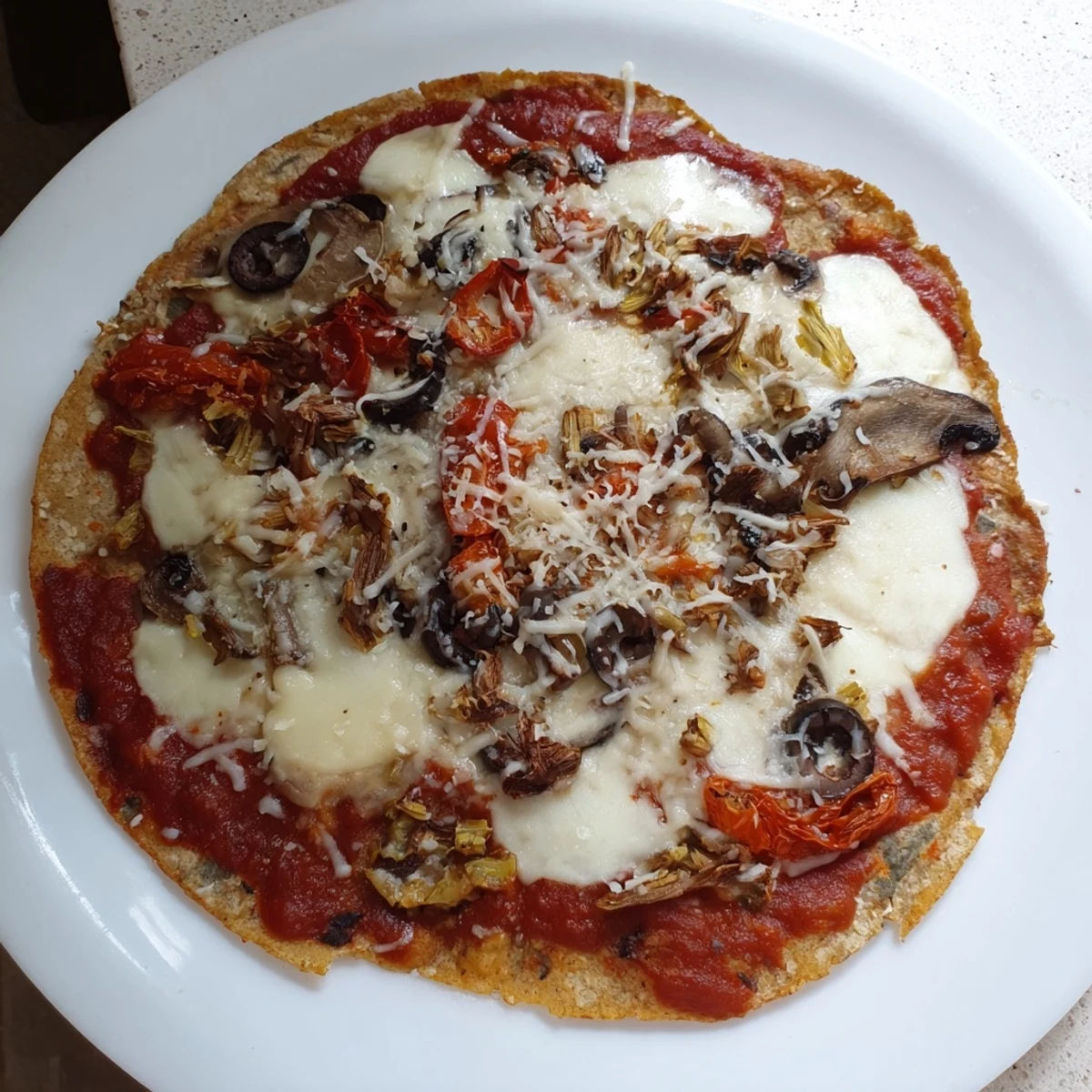 Homemade tortilla pizza, fresh from the oven, with a crispy crust and your favorite simple pantry ingredients.