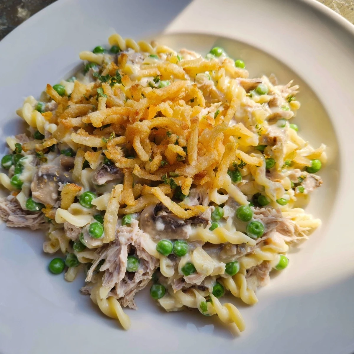 Hearty American-style tuna noodle casserole, filled with tender noodles and savory tuna.