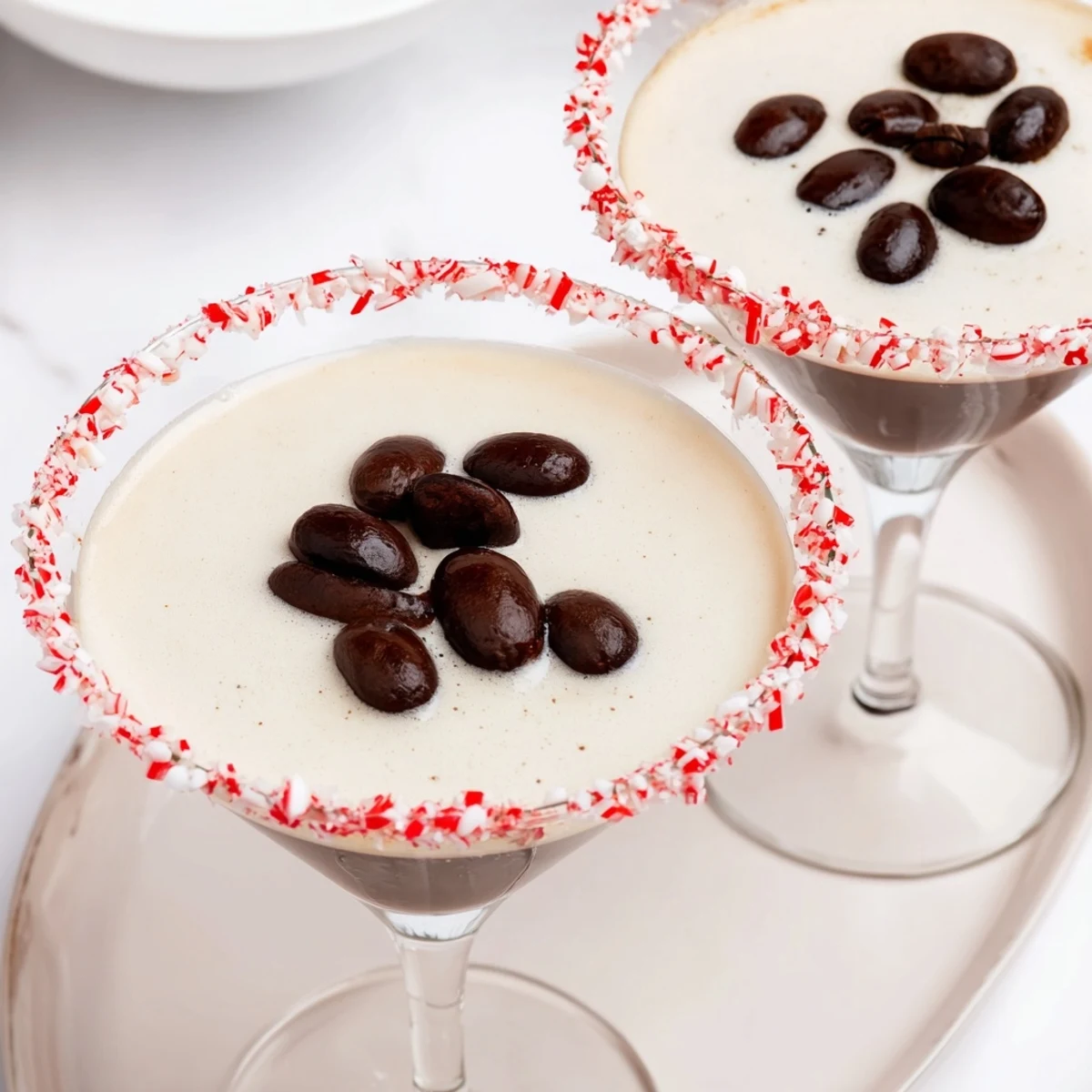 Creamy Peppermint Espresso Martinis, chilled and served in chocolate-peppermint-rimmed glasses, a treat.