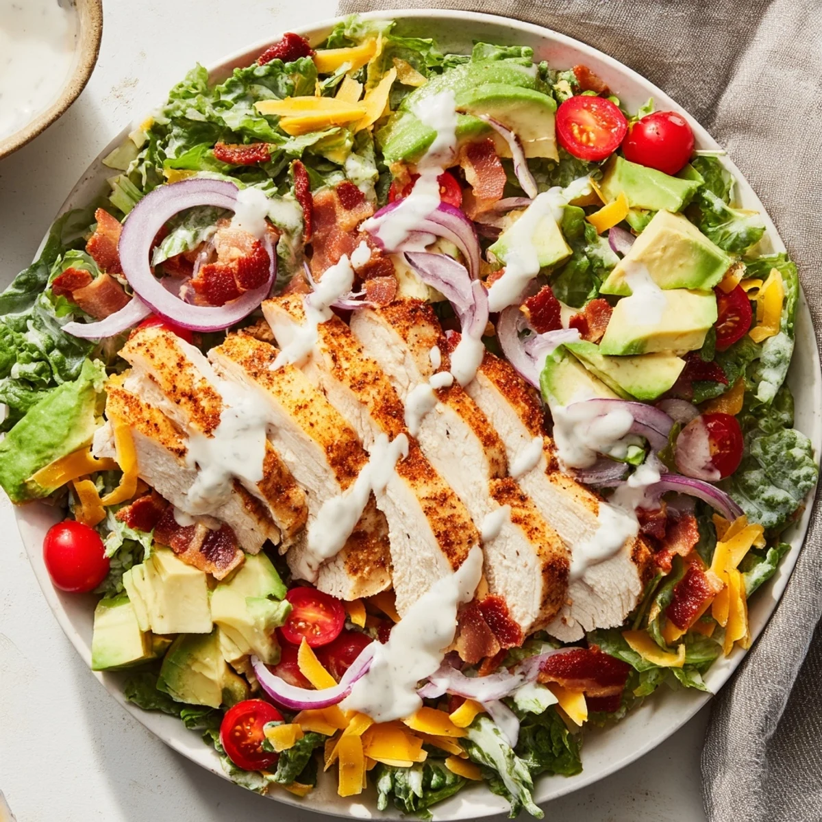 Golden, crispy bacon tops this delicious Crispy Bacon Chicken Salad, ready to satisfy any appetite.