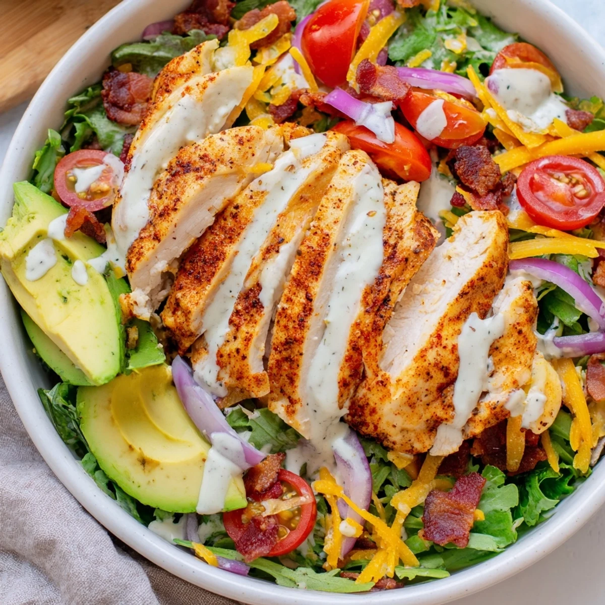 This flavorful Crispy Bacon Chicken Salad has juicy, oven-baked chicken and fresh, mixed ingredients.