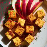 Smoked paprika coats golden cheese cubes in this The Autumn Ember Fall gathering appetizer.
