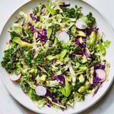 Freshly tossed Green Goddess Detox Cabbage Salad: a colorful mix of crunchy vegetables ready to serve.