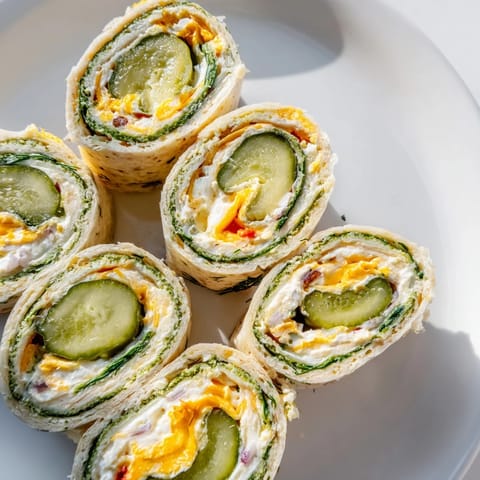 Delicious cream cheese and dill pickle filling in a savory Pickle-in-a-Blanket roll.  