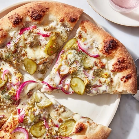 Deliciously unique Pickle Pizza featuring dill pickles and rich crème fraîche sauce.  