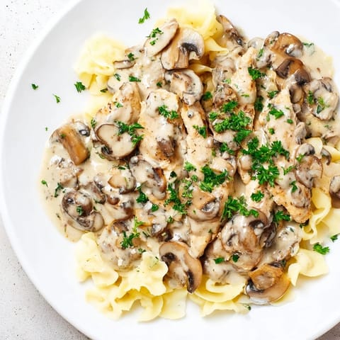 Golden chicken strips are enveloped in a rich sauce; this Creamy Chicken Stroganoff is served beautifully.
