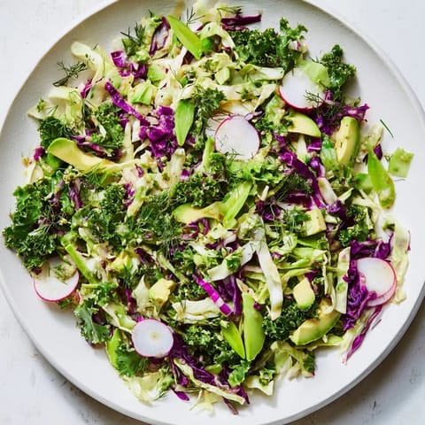 Freshly tossed Green Goddess Detox Cabbage Salad: a colorful mix of crunchy vegetables ready to serve.