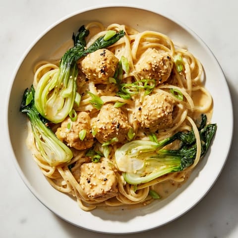 Close-up of golden-brown Miso Butter Salmon Pasta showcasing tender salmon and flavorful sauce.
