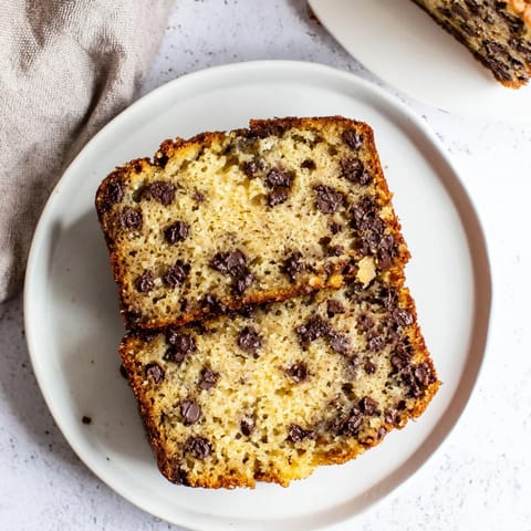 This classic banana bread features a tender crumb and golden-brown top, perfect for breakfast.