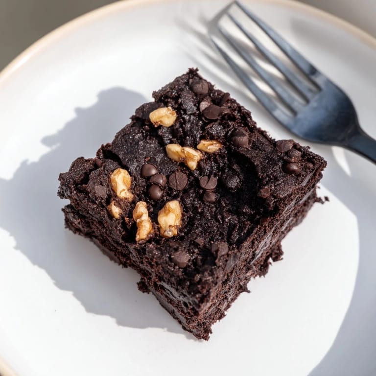 Enjoy rich, gooey brownies using leftover nut-milk pulp for minimal waste.  