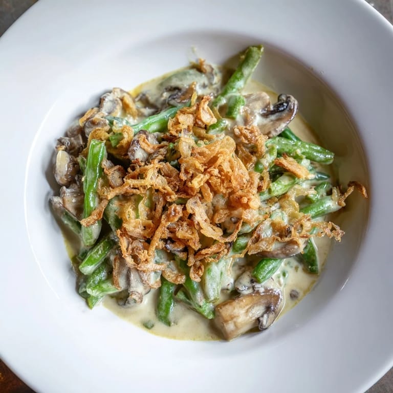 This classic, homemade Old-School Green Bean Casserole features tender green beans in a rich mushroom sauce.