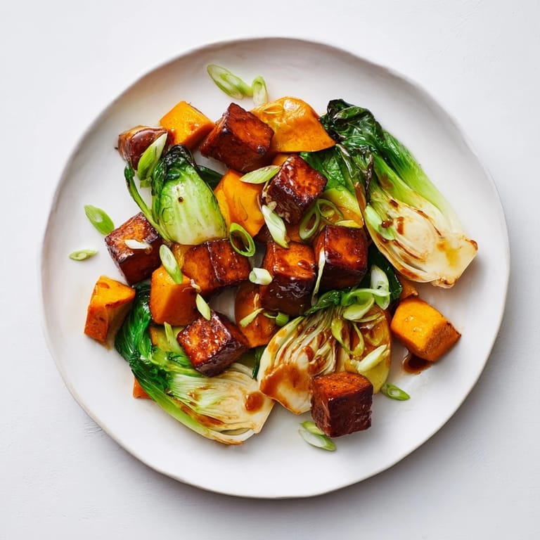 Savory miso glaze coats the caramelized tofu and squash, creating this flavorful Miso-Glazed Tofu entree.