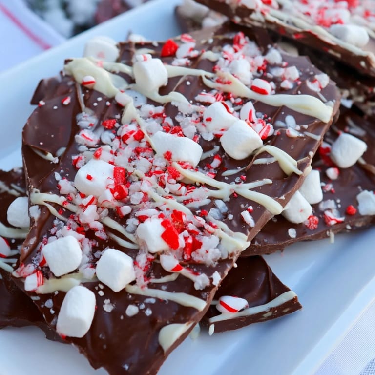 Close-up shot showing melted white chocolate drizzled over the smooth, delicious Viral Hot Chocolate Bomb Bark.