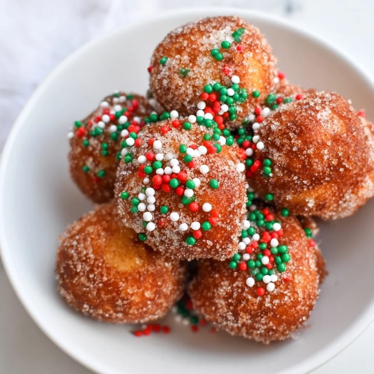 Warm, freshly cooked Air Fryer Christmas Donut Holes, ready to be enjoyed with holiday coffee or cocoa.