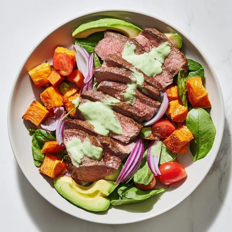 This healthy Beef Avocado Sweet Potato Bowl features fresh avocado slices and tangy lime dressing.