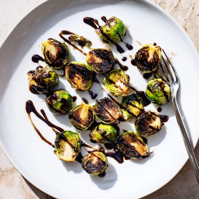Roasted Brussels sprouts with balsamic reduction, served warm with caramelized edges and a tangy finish.