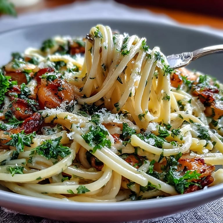 Creamy linguine in lemon butter sauce with peas, topped with Parmesan cheese for a fresh and satisfying vegetarian pasta dinner.